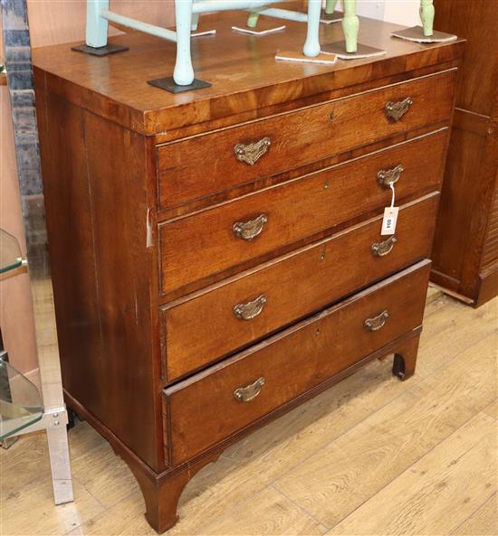 A late George III banded oak chest, fitted four long drawers W.92cm